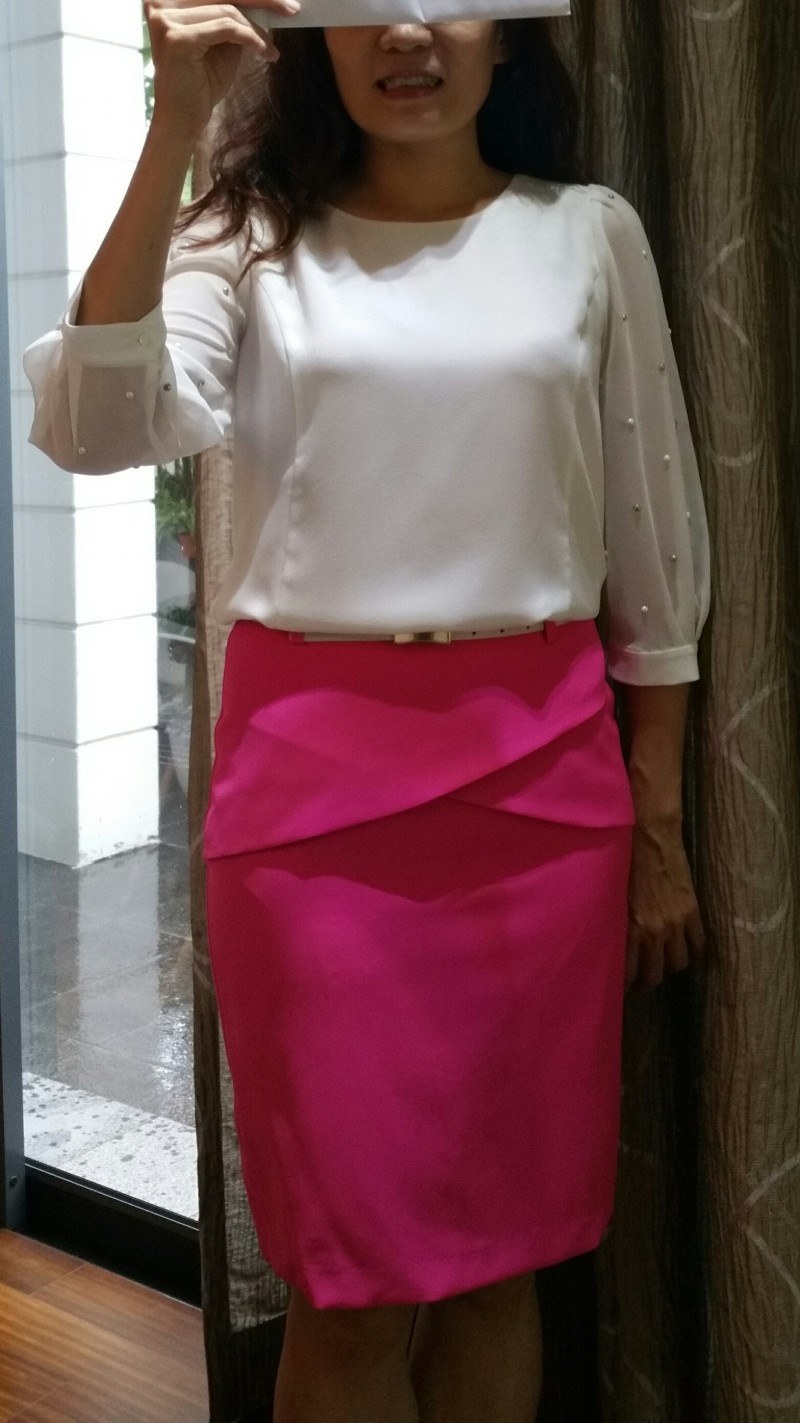 nice pink skirt with a front flap and white belt.