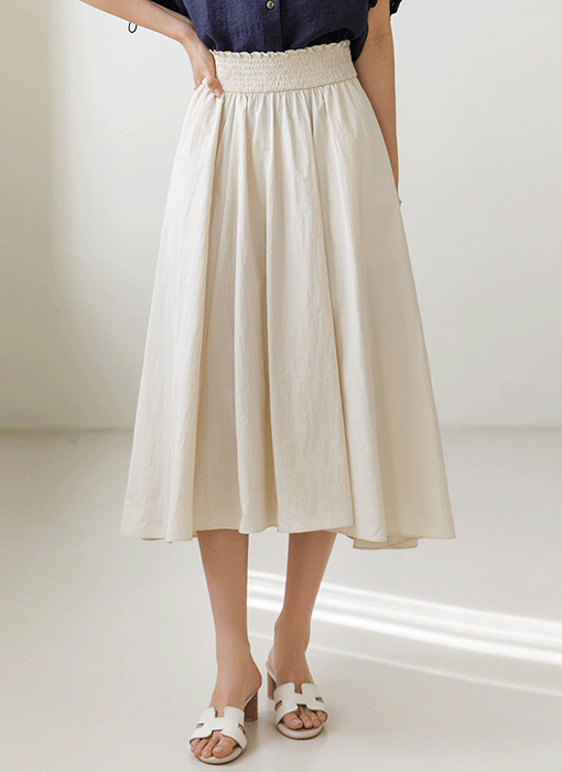 [The Onme] Smocked Sway Flare Skirt